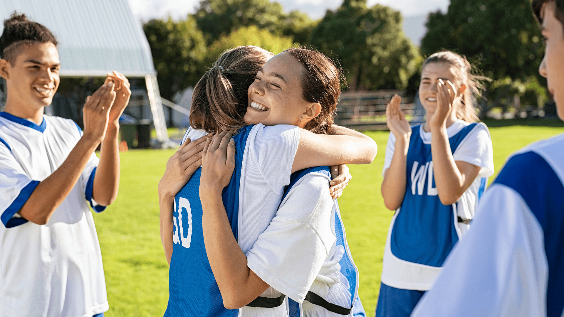 Young people playing sport and celebrating